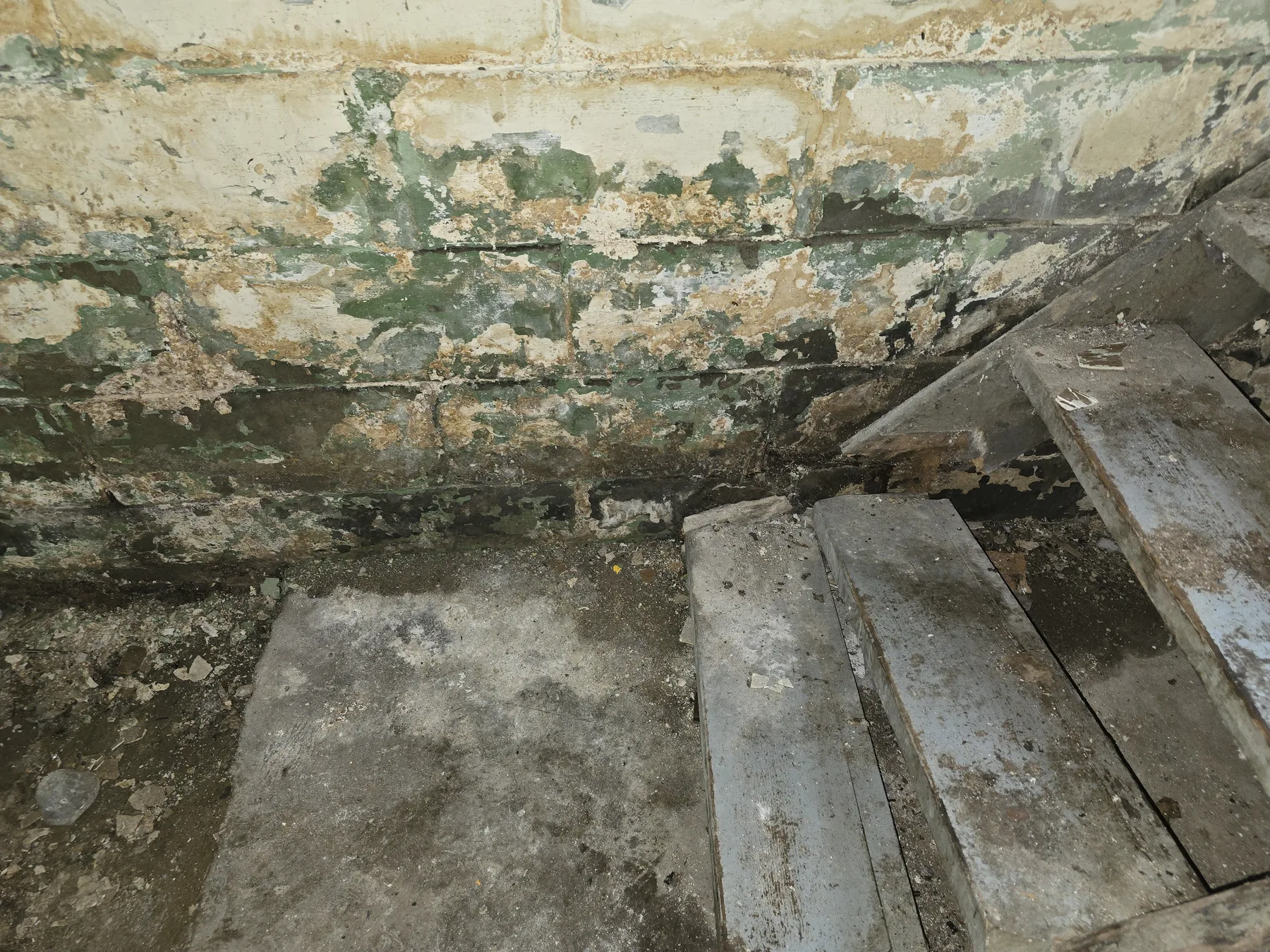 Foundation wall with visible moisture-related deterioration