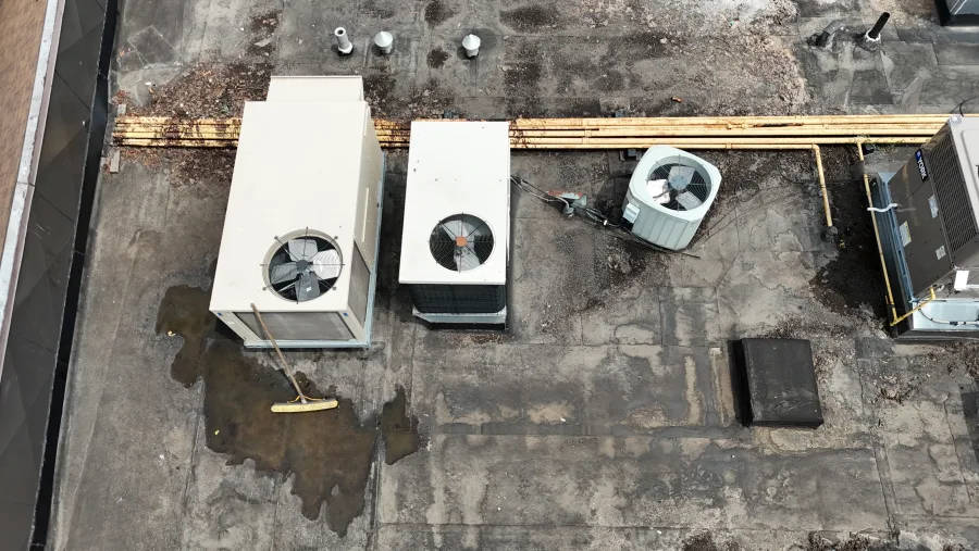 Rooftop mechanical equipment and service connections documented during an assessment