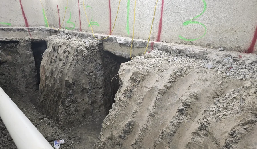 Numbered underpinning excavation stages beside an existing foundation wall