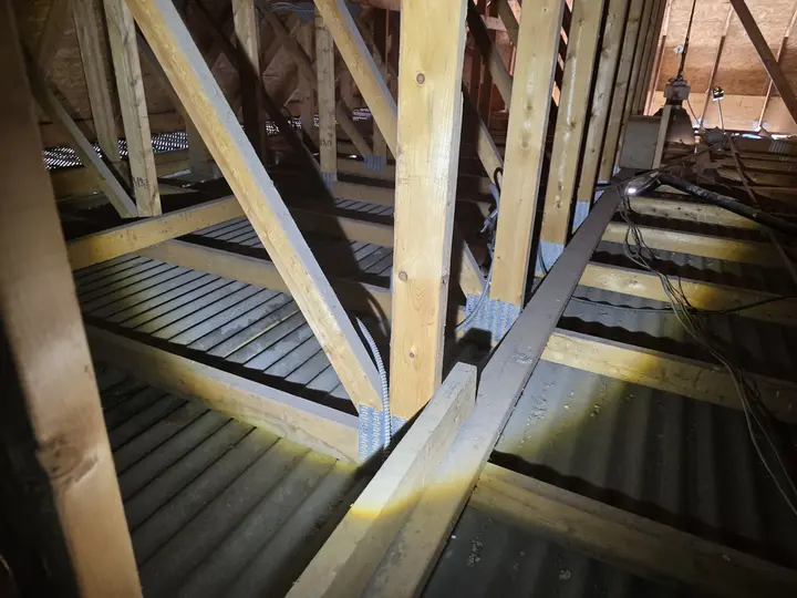 Roof truss connections and structural framing reviewed in an attic