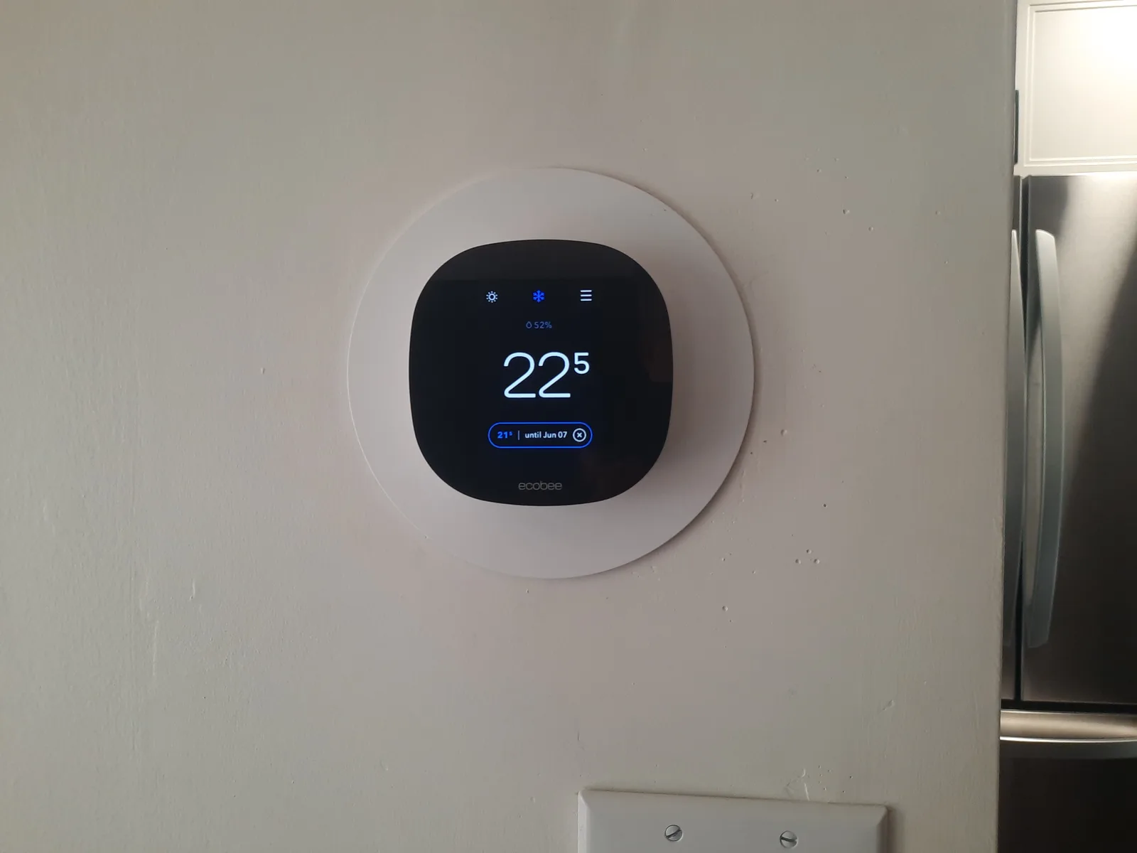 Wall thermostat operating during a home inspection